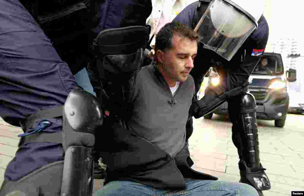 Savo Manojlovic, leader of Move Change party, is detained by Serbian police during a protest over the authorities&#39; plan to begin demolition and removal of the Old Sava Bridge, in Belgrade, Serbia.