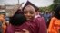 Brooklyn College humanities and social sciences graduate Ameera Badamasi, center, from Nigeria, hugs a student after the college's commencement ceremony, where Sen. Bernie Sanders, I-Vt., delivered the keynote address, May 30, 2017.