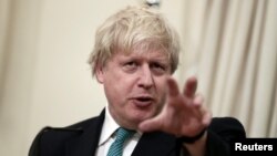FILE - British Foreign Secretary Boris Johnson answers a question during a joint press conference with Greek Foreign Minister Nikos Kotzias (not pictured) following their meeting at the Foreign Ministry in Athens, Greece, April 6, 2017. 
