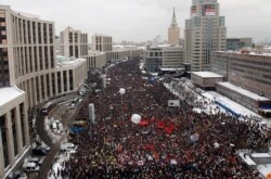 FILE - Demonstrators gather to protest recent parliamentary election results in Moscow, Dec. 24, 2011.