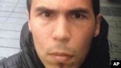 In this undated photo a man, believed to be the gunman who killed dozens at an Istanbul nightclub, films himself and the street behind him as he wanders nearby Istanbul's crowded Taksim square.