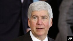 FILE - Michigan Gov. Rick Snyder speaks in Detroit. Snyder is under fire, accused of reacting too slowly to the water crisis in Flint.