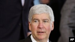 FILE - Michigan Gov. Rick Snyder speaks in Detroit. Snyder is under fire, accused of reacting too slowly to the water crisis in Flint.
