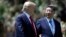 President Donald Trump and Chinese President Xi Jinping walk together after their meetings at Mar-a-Lago, April 7, 2017, in Palm Beach, Florida. 
