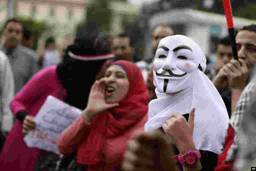Egyptian protesters chant anti-Muslim Brotherhood slogans during a demonstration outside the presidential palace, in Cairo, Egypt, Dec. 5, 2012. 