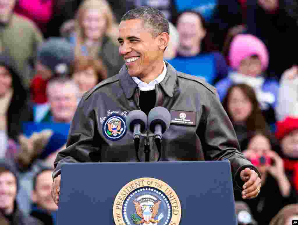 Obama supporters cheer at Austin Straubel International Airport in Green Bay.