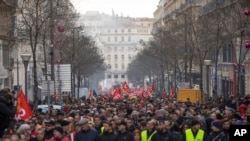 Strikers march during a demonstration in Marseille, southern France, Jan. 14, 2020. 
