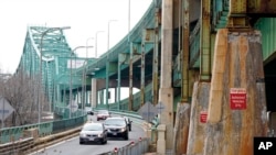 Drivers exit the Tobin Memorial Bridge, March 31, 2021, in Chelsea, Mass. President Joe Biden wants $2 trillion to reengineer America's infrastructure and wants the nation's corporations to pay for it. 
