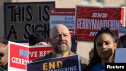 FILE - Demonstrators protest during a Fair Maps rally outside the U.S. Supreme Court, in Washington, U.S., March 26, 2019.
