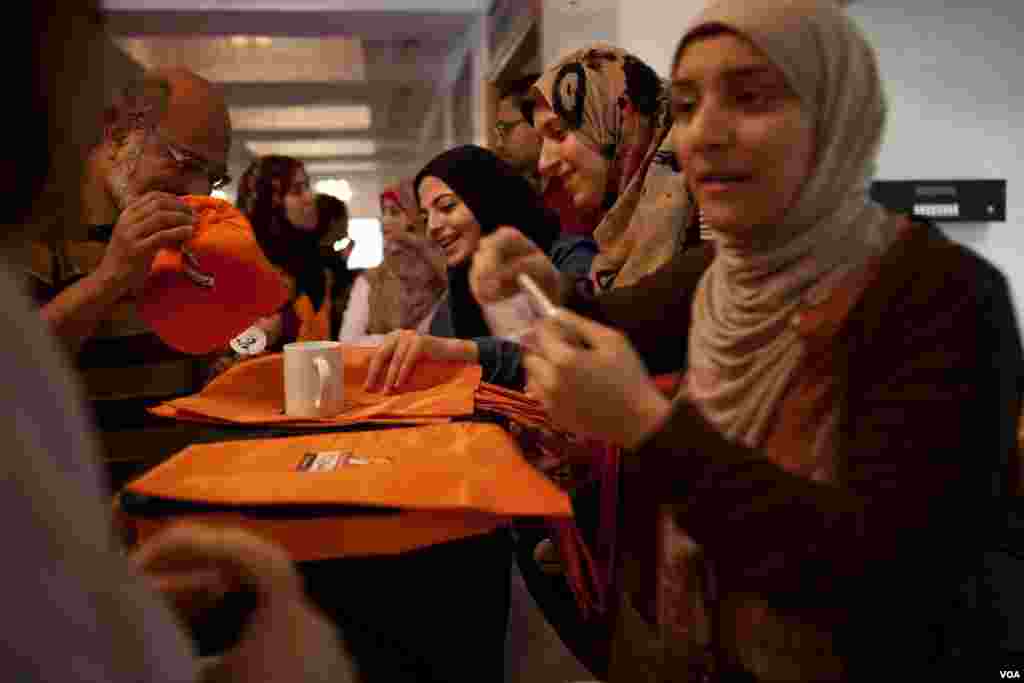 The World Trade Center Flag is presented as friends and relatives of the victims of the September 11, 2001, terrorist attacks, the National September 11 Memorial at the World Trade Center site in New York, September 11, 2012.