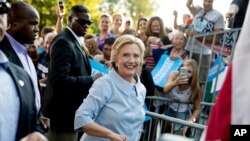 Democratic presidential candidate Hillary Clinton departs after speaking at the 49th Annual Salute to Labor at Illiniwek Park Riverfront in Hampton, Ill., Sept. 5, 2016.