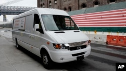 This Nov. 2, 2017, photo shows a Chanje V8070 electric medium-duty truck on display in New York. 