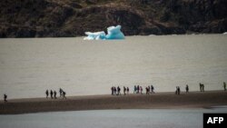 FILE - Tourists visit the Grey Lake, located in the 230,000-hectare Torres del Paine National Park in the Chilean Patagonia, about 1,960 km south of Santiago, Feb. 26, 2016. 