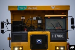 An employee drives an electric dump truck at PT Vale Indonesia's mine in Sorowako, South Sulawesi, Indonesia, Tuesday, Sept. 12, 2023. (AP Photo/Dita Alangkara)