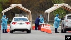 President Donald Trump addresses the daily coronavirus response briefing as Seema Verma, administrator of the Centers for Medicare & Medicaid Services, and Vice President Mike Pence look on, at the White House in Washington, March 18, 2020.