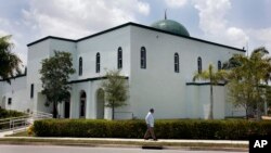 FILE - A man is seen walking past a mosque in Margate, Florida, in a May 14, 2011, photo.