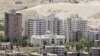 FILE - New buildings are seen in Damascus, where the price of property has been rising sharply.