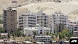 FILE - New buildings are seen in Damascus, where the price of property has been rising sharply.