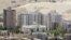 FILE - New buildings are seen in Damascus, where the price of property has been rising sharply.