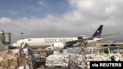 FILE - Staff members of King Salman Humanitarian Aid and Relief Center unload humanitarian aid at Beirut International Airport following a blast in Lebanon, Aug. 7, 2020. Analysts say Lebanon can no longer count on aid from wealthy Gulf Arab states.