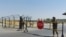 Uzbek soldiers guard a checkpoint near Friendship Bridge over the Amu Darya River, which separates Uzbekistan and Afghanistan, Termez, Uzbekistan, Aug. 15, 2021.