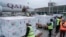 Officials receive boxes of Moderna coronavirus vaccine at the airport in Nairobi, Kenya, Sept. 6, 2021. 