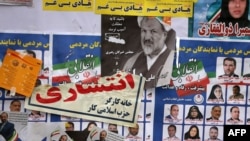 Iranian electoral posters and fliers are pictured on the last day of election campaign in Tehran on February 19, 2020. 