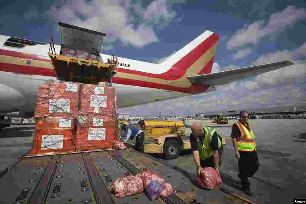 Pallets of supplies are loaded on a 747 aircraft at New York's John F. Kennedy International Airport, Sept. 20, 2014.