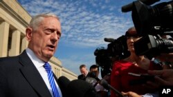 FILE - U.S. Defense Secretary Jim Mattis speaks to reporters at the Pentagon, July 27, 2018. 