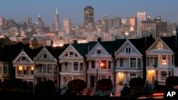 FILE - In this Monday, May 12, 2008 file photo, the "Painted Ladies," a row of historical Victorian homes, underscore the San Francisco skyline in a view from Alamo Square. San Francisco enjoys the benefits of tech fortunes, but its homes are largely unaffordable for most people. (AP Photo/Marcio Jose Sanchez)