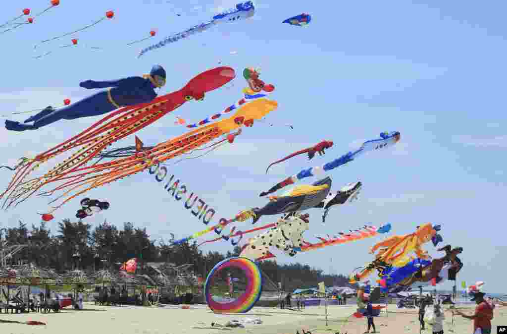 Colorful kites are flown in the sky on Tam Thanh beach during an International Kite Festival in Quang Nam province, Vietnam, June 11, 2017.