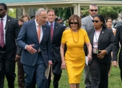 FILE - Senate Minority Leader Chuck Schumer, D-N.Y., left, and Speaker of the House Nancy Pelosi, D-Calif., walk together at the Capitol in Washington, June 20, 2019.