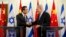 Israeli Prime Minister Benjamin Netanyahu, right, shakes hands with Chinese Foreign Minister Wang Yi before their meeting at the prime minister's office in Jerusalem, Wednesday, Dec. 18, 2013.