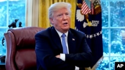 Presiden AS Donald Trump berbicara di Gedung Putih, di Washington, 17 Januari 2018. 