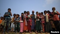 Rohingya refugee children leave school after a morning of classes in Shamplapur refugee camp in Cox's Bazaar, Bangladesh, March 26, 2018. REUTERS/Clodagh Kilcoyne