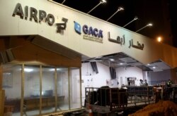 A broken sign is seen at the entrance of Abha airport in the popular mountain resort of Abha in the southwest of Saudi Arabia on August 31, 2021.