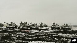 Russian tanks T-72B3 take part in drills at the Kadamovskiy firing range in the Rostov region in southern Russia, Jan. 12, 2022. 