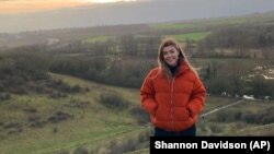 FILE - Fashion school graduate Phoebe St. Leger poses for a photo in Florence, Italy, Jan. 25, 2018. (Shannon Davidson via AP)