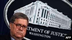 FILE - U.S. Attorney General William Barr holds a press conference at the Department of Justice in Washington, Jan. 13, 2020.