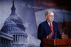 FILE - Senate Majority Leader Mitch McConnell of Kentucky speaks with reporters on Capitol Hill in Washington, April 21, 2020.
