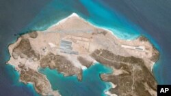 This, May 25, 2021, satellite image released by Planet Labs Inc. shows a mysterious air base being built on Yemen's volcanic Mayun Island. (Planet Labs Inc. via AP)