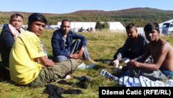 Migrants in front of the temporary reception migrant center Lipa, near Bihac, October 20, 2020.