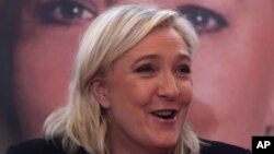 French far-right leader and National Front Party, Marine Le Pen, addresses the media during a news conference, Dec. 7, 2015, in Lille. France's far-right National Front ran strongly in a first-round regional vote that was the first election since an attack by Islamic extremists left 130 dead in Paris. 