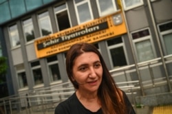 Actress Ruges Kirici speaks to media in front of Istanbul's Municipal Theatre building after Turkish authorities banned a Kurdish-language play, in Gaziosmanpasa district, Istanbul, Turkey, Oct. 13, 2020.