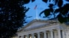 FILE - This June 6, 2019, photo shows the U.S. Treasury Department building at dusk in Washington. 