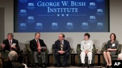 FILE - Stephen Moore, left, leads a panel with, from left, Robert Asahina, Clint Bolick, Jennifer Hunt and Pia Orrenius at the Federal Reserve Bank of Dallas for a conference, Dec. 4, 2012, in Dallas.
