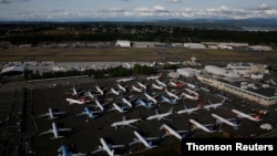 FILE PHOTO: Boeing 737 Max aircraft are parked in a parking lot at Boeing Field in this aerial photo taken over Seattle. The 737 MAX was grounded in March 2019 after the crash of Ethiopian Airlines Flight 302 near Addis Ababa which killed all 157 aboard.