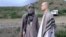 FILE - In this image taken from video obtained from the Voice of Jihad website in June 2014, Army Sgt. Bowe Bergdahl, right, stands with a Taliban fighter in eastern Afghanistan.