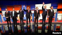 Republican presidential candidates Sen. Rand Paul, Gov. Chris Christie, Dr. Ben Carson, Sen. Ted Cruz, Sen. Marco Rubio, former Gov. Jeb Bush and Gov. John Kasich stand onstage at the start of the Republican presidential debate in Des Moines, Iowa Jan. 28