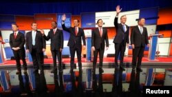 Republican presidential candidates Sen. Rand Paul, Gov. Chris Christie, Dr. Ben Carson, Sen. Ted Cruz, Sen. Marco Rubio, former Gov. Jeb Bush and Gov. John Kasich stand onstage at the start of the Republican presidential debate in Des Moines, Iowa Jan. 28